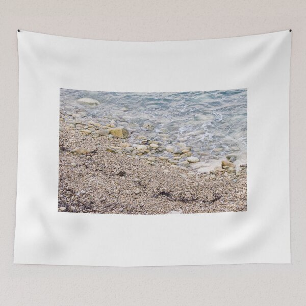 Item preview, Pebble Beach Shoreline With Gentle Waves, Rocks And Seaweed On A Calm Coastal Seashore designed and sold by Nmallia.