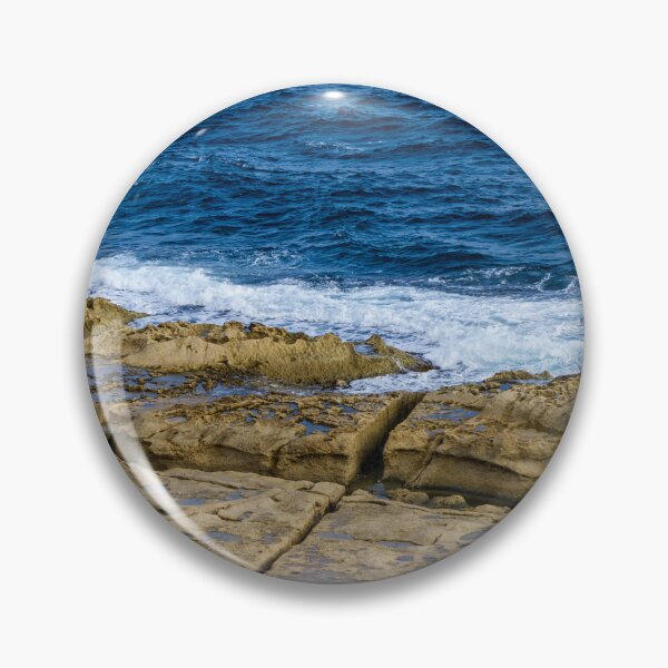 Item preview, Rugged Rocky Coastline with Blue Ocean Waves Crashing on Sandstone Shore designed and sold by Nmallia.