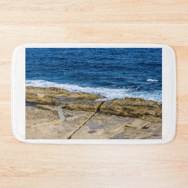 Item preview, Rugged Rocky Coastline with Blue Ocean Waves Crashing on Sandstone Shore designed and sold by Nmallia.