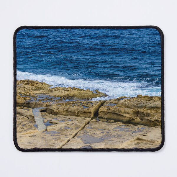 Item preview, Rugged Rocky Coastline with Blue Ocean Waves Crashing on Sandstone Shore designed and sold by Nmallia.