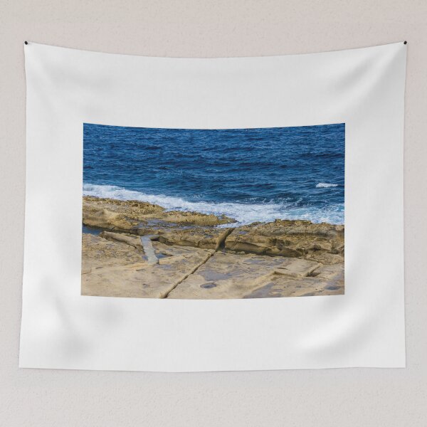 Item preview, Rugged Rocky Coastline with Blue Ocean Waves Crashing on Sandstone Shore designed and sold by Nmallia.
