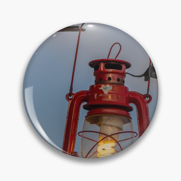 Item preview, Red Vintage Lantern Hanging From Weathered Wood With Warm Glowing Bulb At Dusk designed and sold by Nmallia.