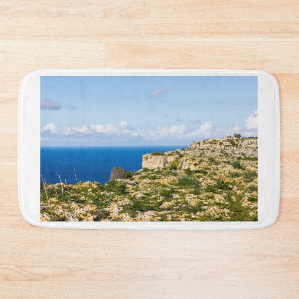 Item preview, Rocky Coastal Cliffs Overlooking Deep Blue Sea Under Clear Sky With Wild Grass designed and sold by Nmallia.