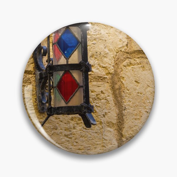 Item preview, Vintage Stained Glass Wall Lantern Mounted On Weathered Stone Wall In Sunny Alleyway designed and sold by Nmallia.