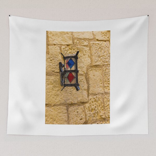 Item preview, Vintage Stained Glass Wall Lantern Mounted On Weathered Stone Wall In Sunny Alleyway designed and sold by Nmallia.