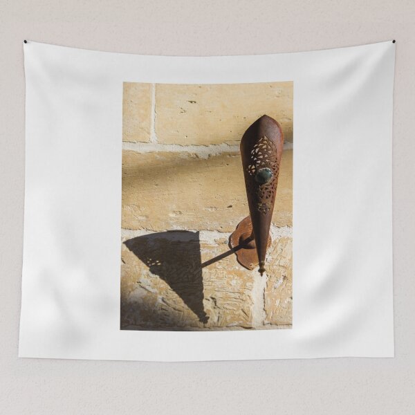 Item preview, Rusted Decorative Metal Sconce Casting a Sharp Shadow on Sunlit Stone Wall, Vintage Rustic Texture designed and sold by Nmallia.