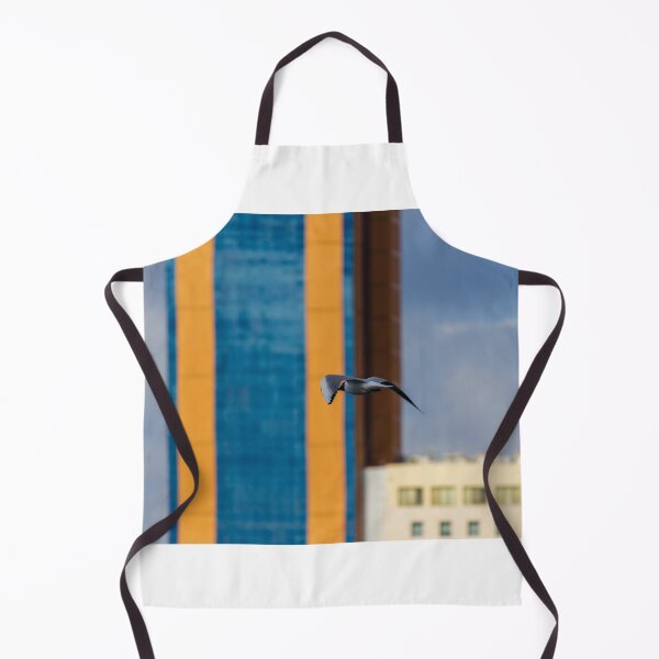 Item preview, Seagull In Flight Over Urban Cityscape With Colorful High-Rise Buildings And Cloudy Sky designed and sold by Nmallia.