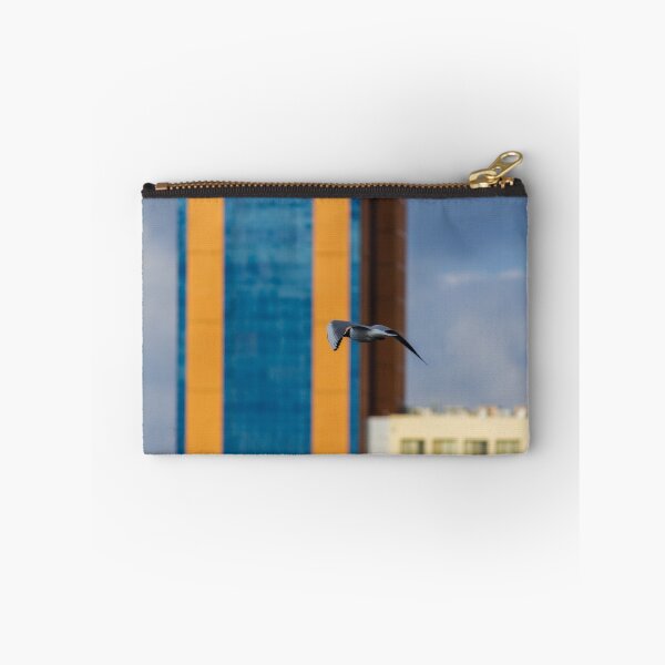 Item preview, Seagull In Flight Over Urban Cityscape With Colorful High-Rise Buildings And Cloudy Sky designed and sold by Nmallia.