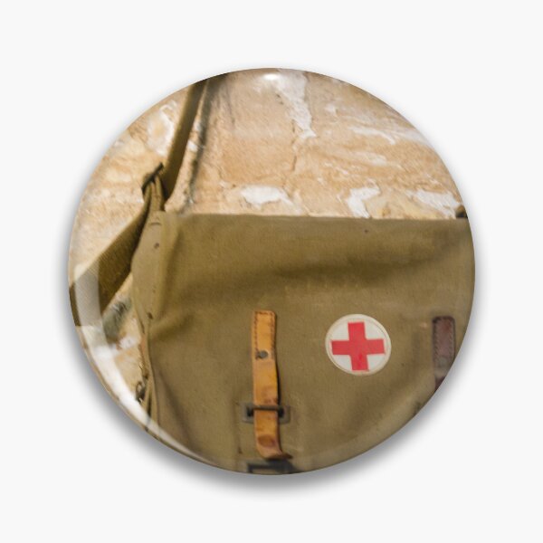 Item preview, Vintage Red Cross Canvas Medical Bag Hanging on Stone Wall, Military First Aid Satchel designed and sold by Nmallia.
