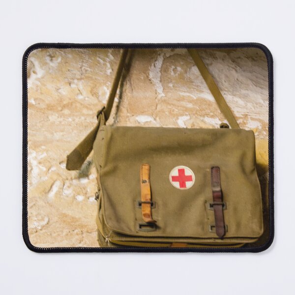 Item preview, Vintage Red Cross Canvas Medical Bag Hanging on Stone Wall, Military First Aid Satchel designed and sold by Nmallia.