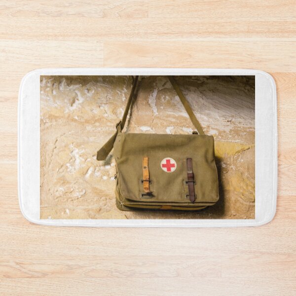 Item preview, Vintage Red Cross Canvas Medical Bag Hanging on Stone Wall, Military First Aid Satchel designed and sold by Nmallia.