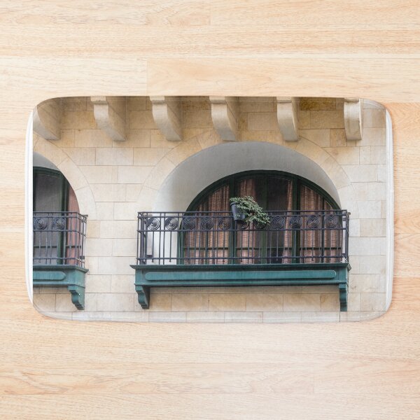 Item preview, Arched Balcony With Iron Railing And Potted Plant On Warm Stone Facade designed and sold by Nmallia.