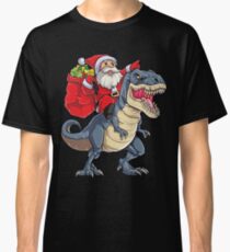 Camiseta clásica Santa Riding Dinosaur T Rex T-shirt Regalos de Navidad X-mas Niños Niños Niñas Hombre Mujeres