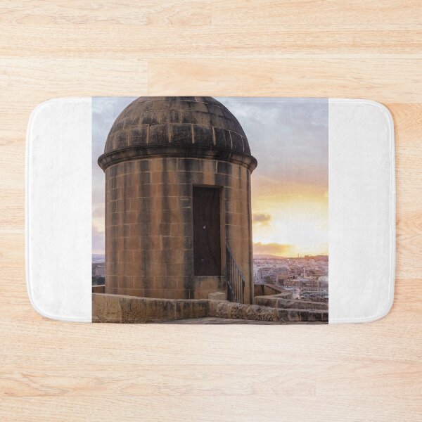 Item preview, Historic Stone Watchtower Turret Overlooking City Skyline at Sunset With Dramatic Sky designed and sold by Nmallia.