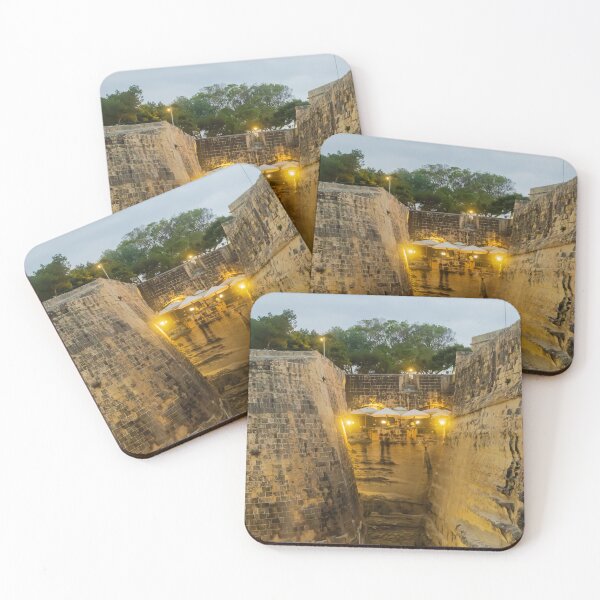 Item preview, Historic Stone Fortress Walls With Lit Terrace Cafe And Narrow Moat At Dusk designed and sold by Nmallia.