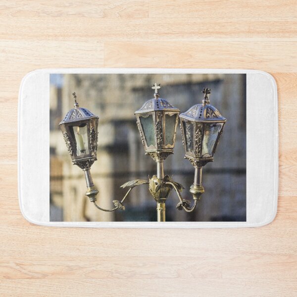 Item preview, Ornate Vintage Brass Lantern With Lit Candle Outside Historic Church — Three-Arm Decorative Street Lamp designed and sold by Nmallia.
