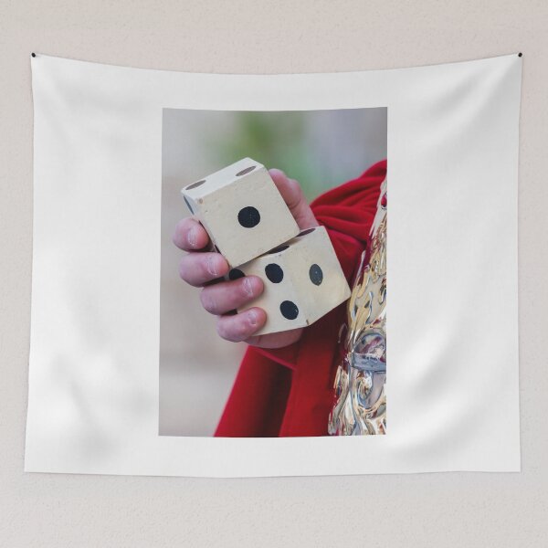 Item preview, Close-Up Of Hand Holding Vintage Wooden Dice Over Red Robe Symbolizing Chance, Luck And Gambling designed and sold by Nmallia.