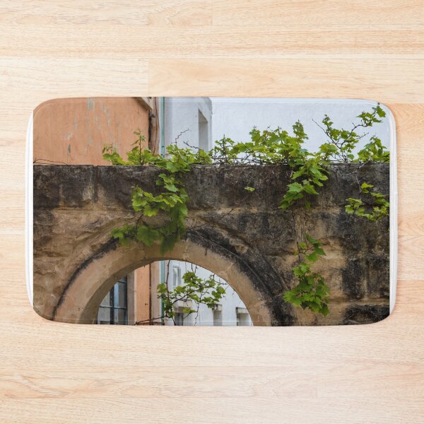 Item preview, Historic Stone Arch With Green Vines Climbing Old Wall and Mediterranean Urban Architecture designed and sold by Nmallia.