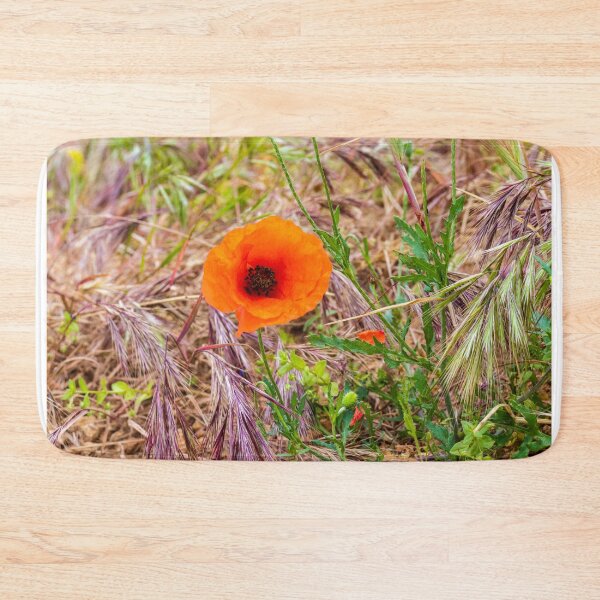 Item preview, Vibrant Orange Poppy Blooming Among Wild Grasses In A Sunlit Meadow Landscape designed and sold by Nmallia.