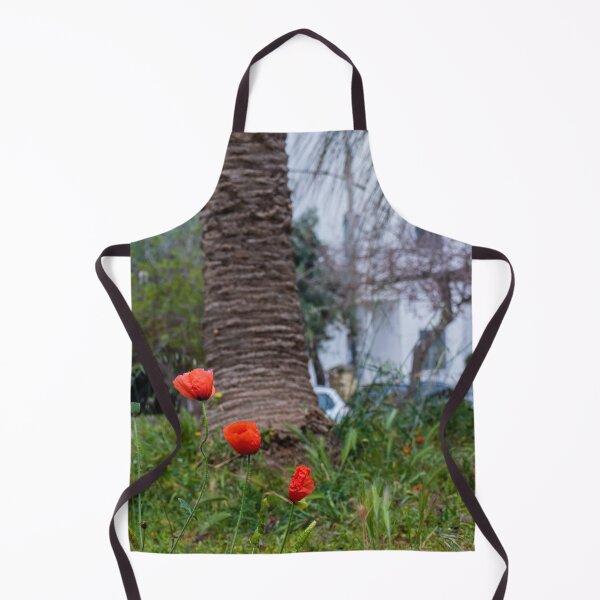Item preview, Red Poppies Blooming In An Urban Garden Next To A Palm Tree Trunk On A Spring Day designed and sold by Nmallia.