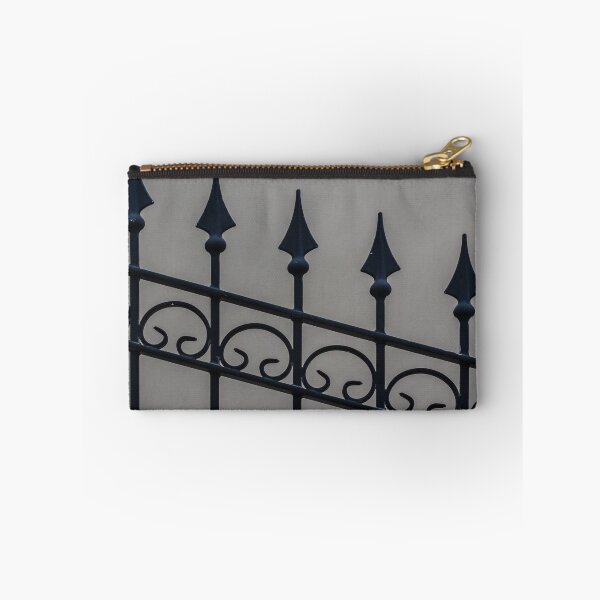 Item preview, Close-Up Of Ornamental Wrought Iron Fence With Pointed Spikes Against Neutral Wall designed and sold by Nmallia.