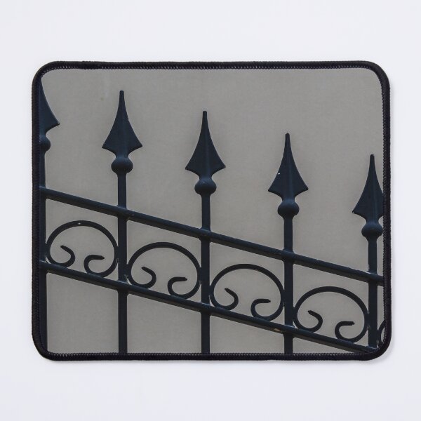 Item preview, Close-Up Of Ornamental Wrought Iron Fence With Pointed Spikes Against Neutral Wall designed and sold by Nmallia.