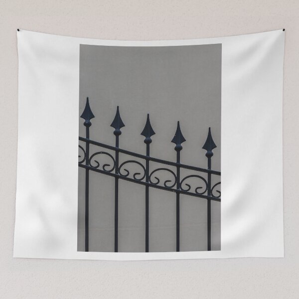 Item preview, Close-Up Of Ornamental Wrought Iron Fence With Pointed Spikes Against Neutral Wall designed and sold by Nmallia.