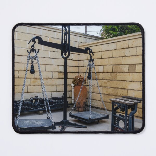 Item preview, Antique Metal Balance Scale With Chains and Platforms in Stone-Walled Courtyard Display designed and sold by Nmallia.