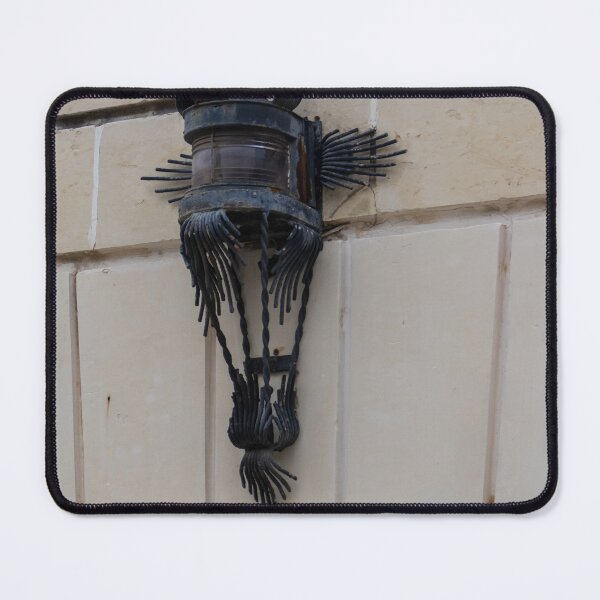 Item preview, Vintage Wrought Iron Lantern Wall Sconce Mounted On Stone Facade With Ornate Metalwork designed and sold by Nmallia.