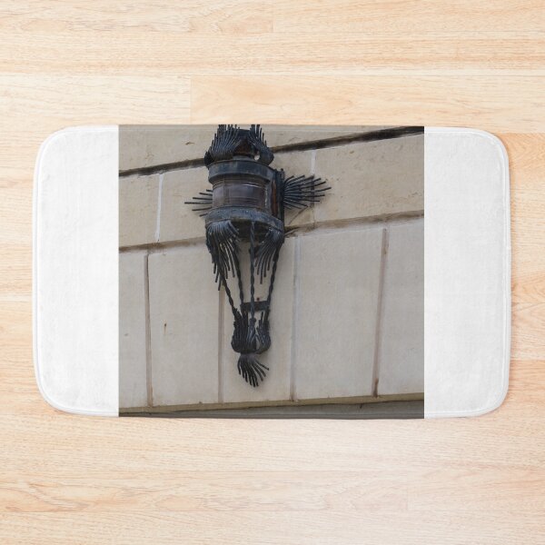 Item preview, Vintage Wrought Iron Lantern Wall Sconce Mounted On Stone Facade With Ornate Metalwork designed and sold by Nmallia.