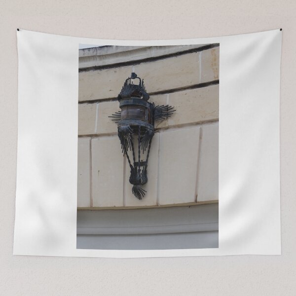 Item preview, Vintage Wrought Iron Lantern Wall Sconce Mounted On Stone Facade With Ornate Metalwork designed and sold by Nmallia.