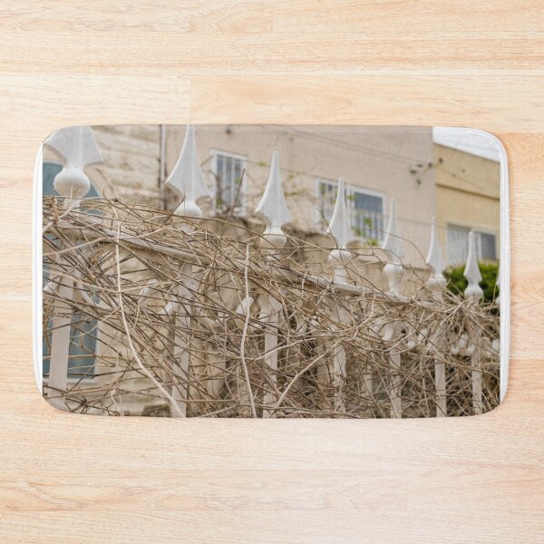 Item preview, White Iron Fence Covered in Dry Vines Outside Residential Mediterranean-Style Home Facade and Balcony designed and sold by Nmallia.