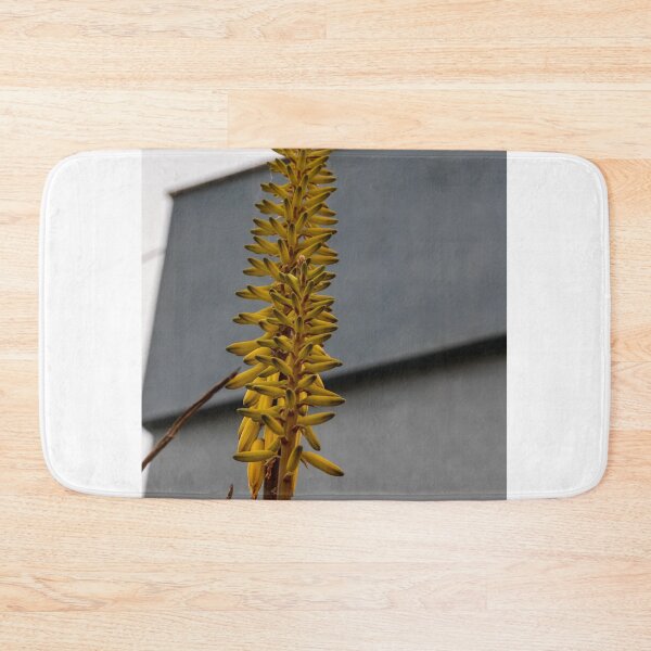 Item preview, Yellow Aloe Flower Spike Against Modern Gray Building Urban Architecture Vertical Close-Up designed and sold by Nmallia.