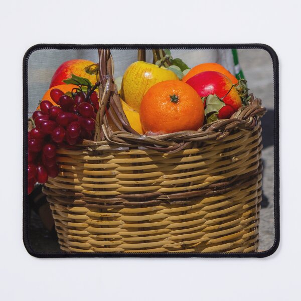 Item preview, Wicker Fruit Basket With Oranges, Apples and Grapes On Stone Pavement Outdoors designed and sold by Nmallia.
