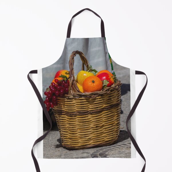 Item preview, Wicker Fruit Basket With Oranges, Apples and Grapes On Stone Pavement Outdoors designed and sold by Nmallia.