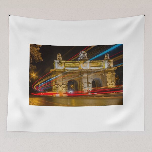 Item preview, Nighttime Long Exposure Of Historic City Arch With Colorful Light Trails And Passing Traffic designed and sold by Nmallia.