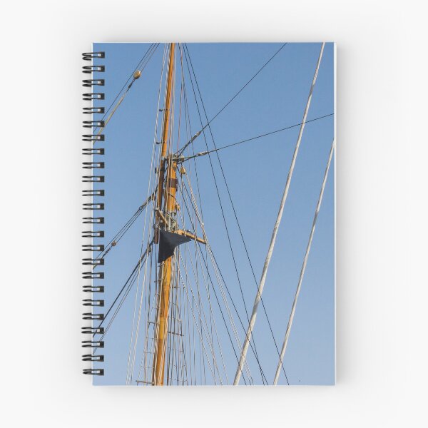 Item preview, Tall Wooden Sailboat Masts and Rigging Against Clear Blue Sky With Nautical Details designed and sold by Nmallia.