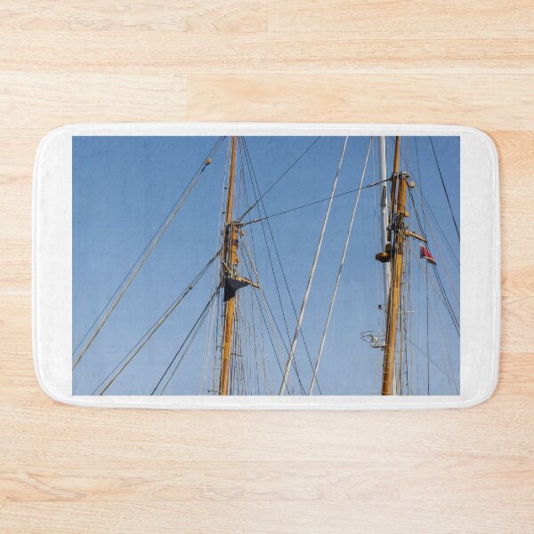 Item preview, Tall Wooden Sailboat Masts and Rigging Against Clear Blue Sky With Nautical Details designed and sold by Nmallia.