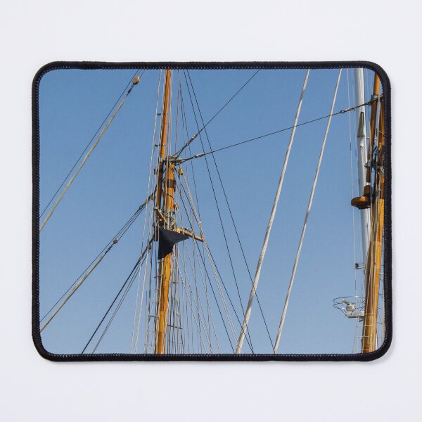 Item preview, Tall Wooden Sailboat Masts and Rigging Against Clear Blue Sky With Nautical Details designed and sold by Nmallia.