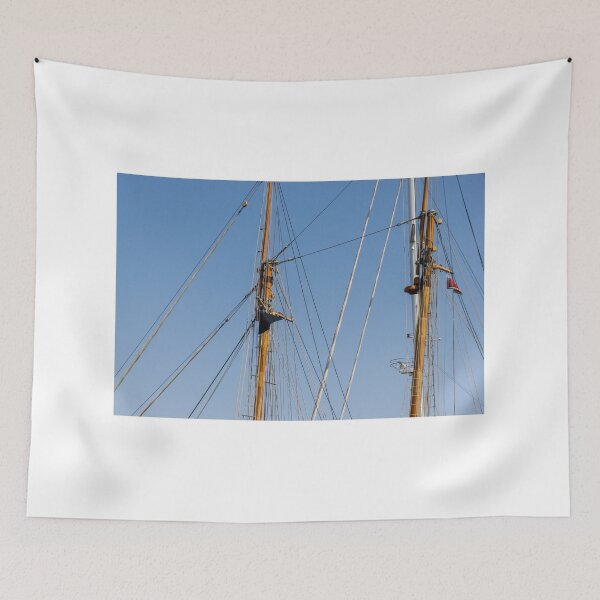 Item preview, Tall Wooden Sailboat Masts and Rigging Against Clear Blue Sky With Nautical Details designed and sold by Nmallia.