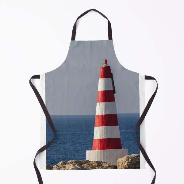 Item preview, Red and White Striped Coastal Beacon On Rocky Shore With Calm Blue Sea and Sky designed and sold by Nmallia.