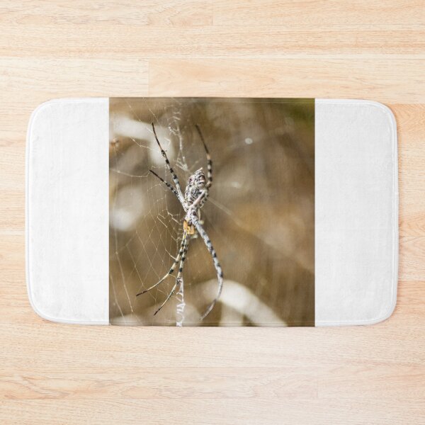 Item preview, Striped Orb Weaver Spider Resting in Intricate Web With Blurred Natural Background designed and sold by Nmallia.