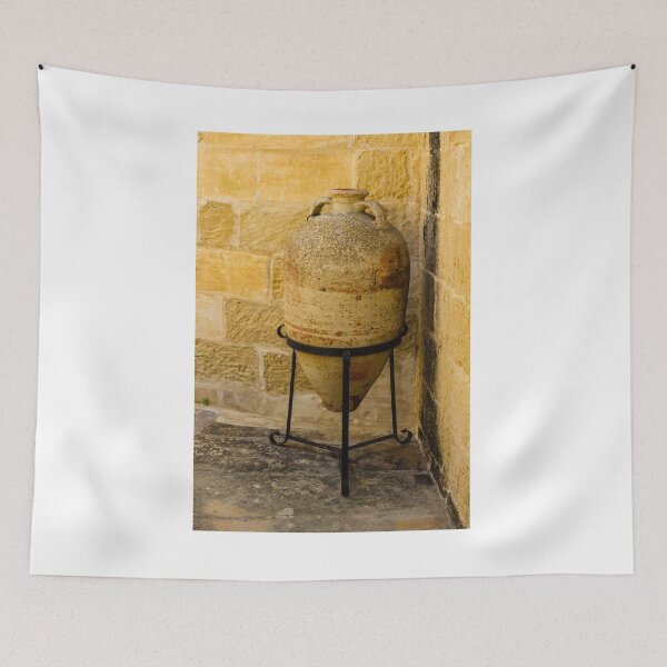 Item preview, Weathered Clay Amphora Pottery Jar On Iron Stand Against Sunlit Limestone Wall In Mediterranean Courtyard designed and sold by Nmallia.