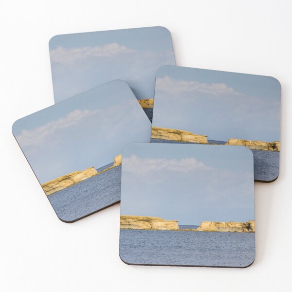 Item preview, Golden Sandstone Sea Stacks and Low Islets on Calm Blue Sea Beneath Soft Cloud Sky designed and sold by Nmallia.