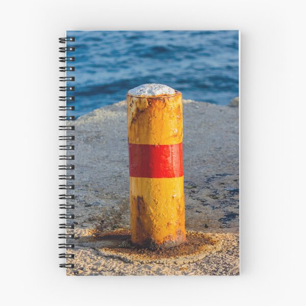 Item preview, Rusty Yellow and Red Bollard on Sunny Harbor Pier With Blue Sea and Weathered Texture designed and sold by Nmallia.