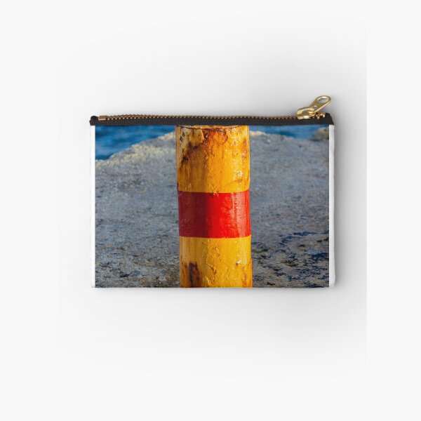 Item preview, Rusty Yellow and Red Bollard on Sunny Harbor Pier With Blue Sea and Weathered Texture designed and sold by Nmallia.