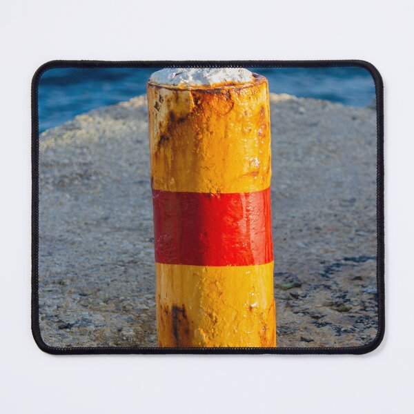 Item preview, Rusty Yellow and Red Bollard on Sunny Harbor Pier With Blue Sea and Weathered Texture designed and sold by Nmallia.