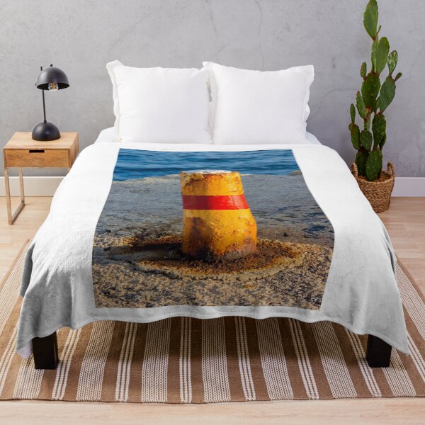 Item preview, Rusty Yellow and Red Bollard on Sunny Harbor Pier With Blue Sea and Weathered Texture designed and sold by Nmallia.