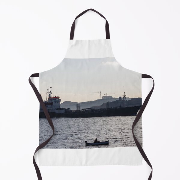 Item preview, Silhouette Cargo Ship and Small Rowboat on Calm Sea Near Coastal Construction at Dusk designed and sold by Nmallia.