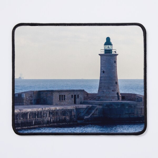 Item preview, Solitary Lighthouse on Stone Breakwater Overlooking Calm Blue Sea at Harbor Entrance With Distant Ship designed and sold by Nmallia.